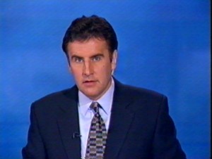 Dermot Murnaghan in the ITN news studio, broadcasting on ITV.